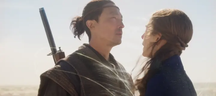 Thin glowing curves wrapping around a man facing a woman in the desert